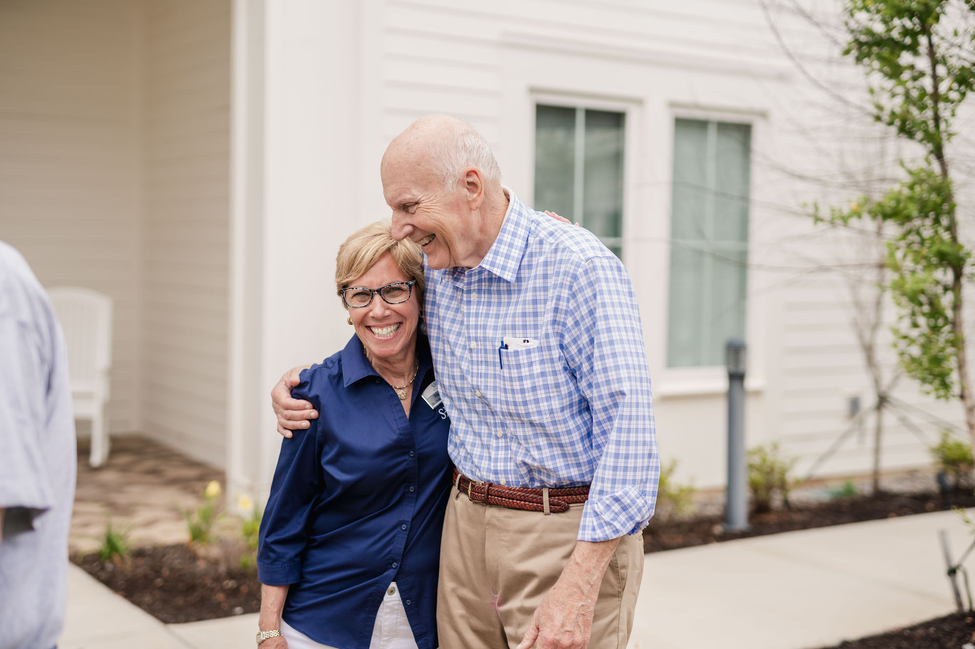The Claiborne at Baton Rouge employee walking with senior resident
