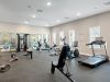 The Claiborne at Brickyard Crossing fitness studio with gym equipment