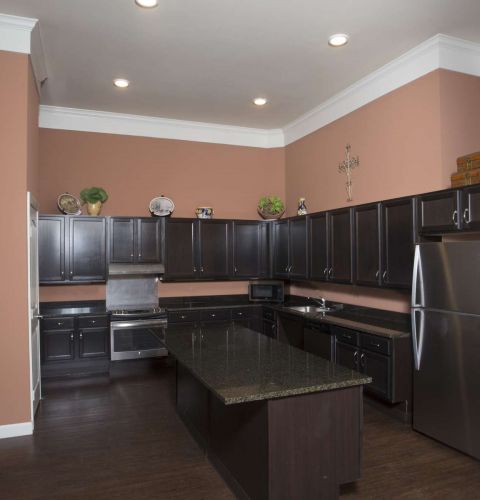The Claiborne at Thibodaux senior apartment full kitchen with stainless steel appliances and high-end finishes