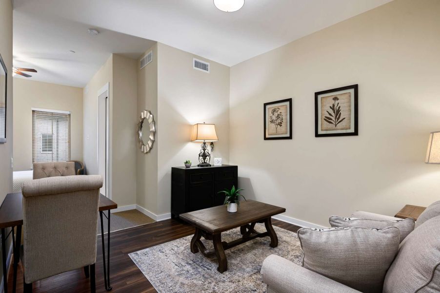 The Claiborne at West Lake senior living community one bedroom apartment living area